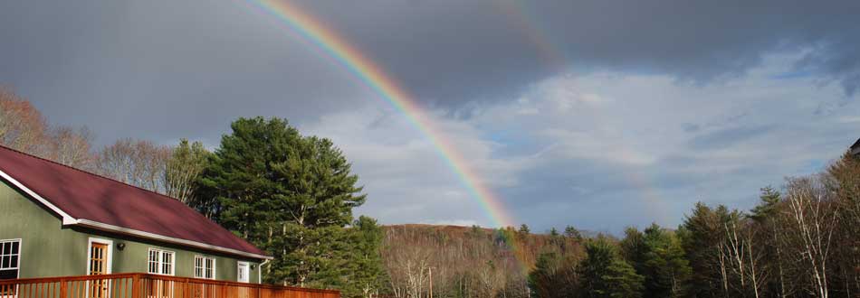 Rainbow over the tasting room at Savage Oakes Vineyard & Winery